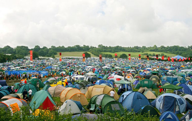 Thousands of tents are pitched by music